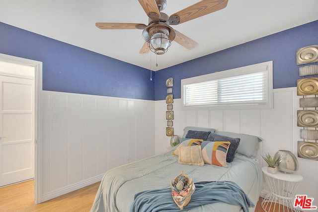 bedroom featuring ceiling fan and light wood-type flooring