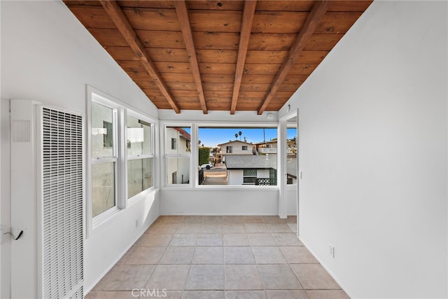 unfurnished sunroom with lofted ceiling with beams and wooden ceiling