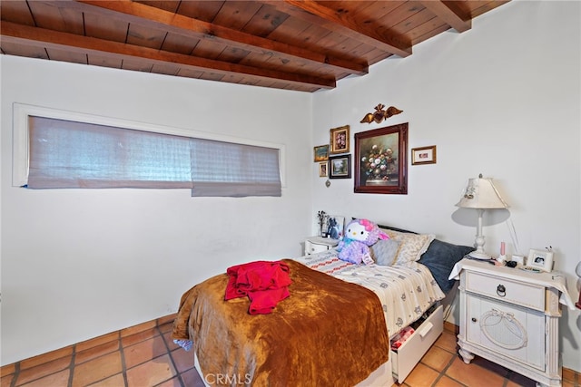 bedroom with light tile patterned floors, wooden ceiling, and beamed ceiling