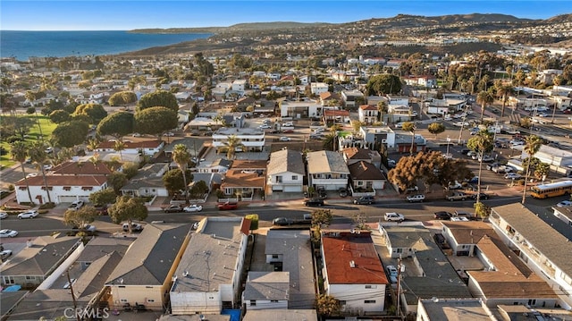 aerial view featuring a water and mountain view