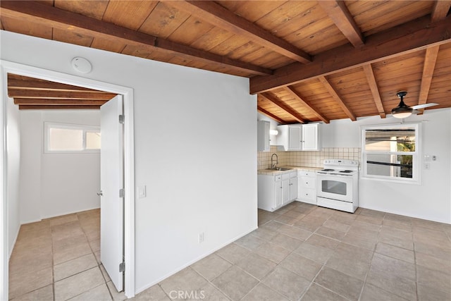 kitchen with white range with electric stovetop, sink, white cabinets, decorative backsplash, and plenty of natural light