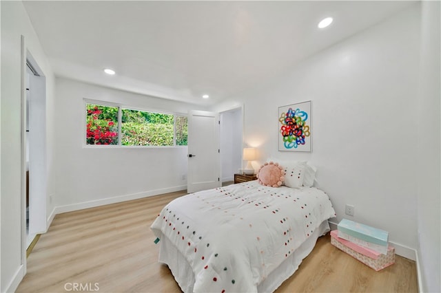 bedroom with light wood-type flooring