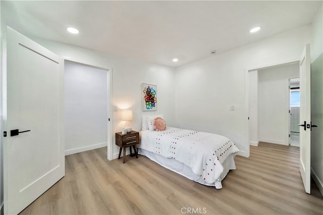 bedroom with light hardwood / wood-style floors