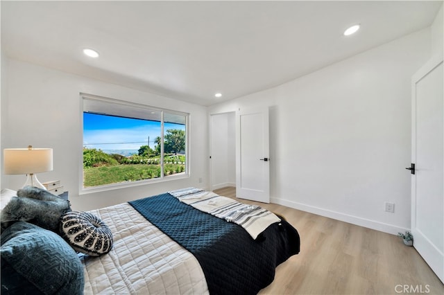 bedroom with light wood-type flooring