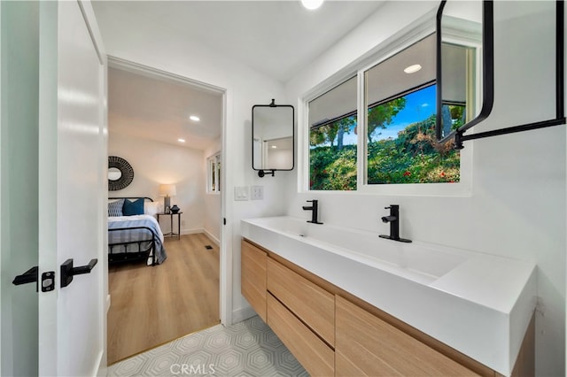 bathroom with vanity and wood-type flooring