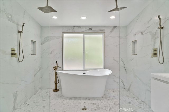 bathroom featuring independent shower and bath and tile walls