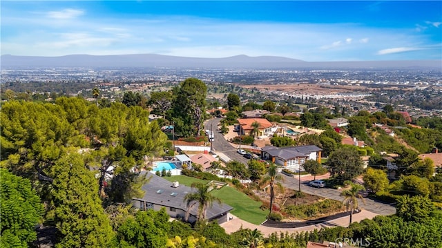 birds eye view of property with a mountain view