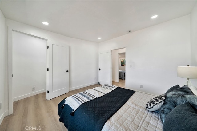 bedroom with light hardwood / wood-style floors