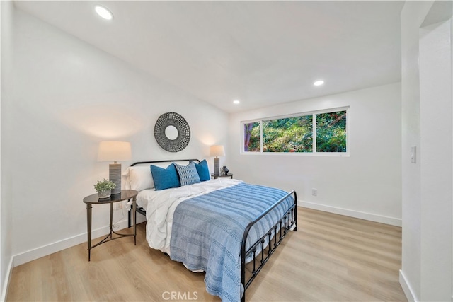 bedroom with light hardwood / wood-style flooring