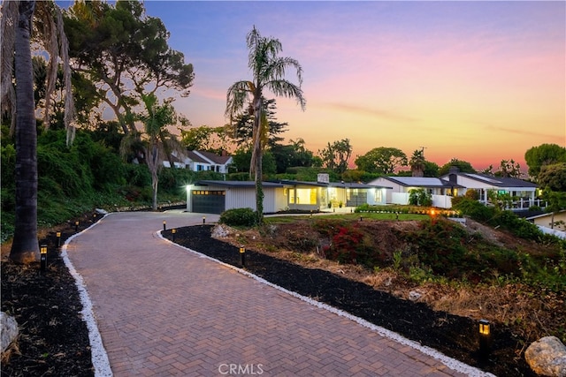 single story home with a garage