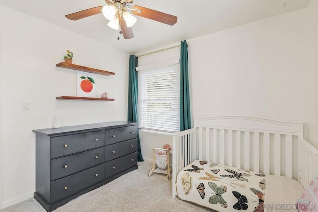 carpeted bedroom with ceiling fan