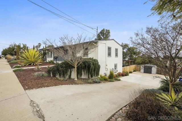 view of home's exterior featuring a storage shed