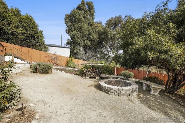 view of patio / terrace featuring a fire pit