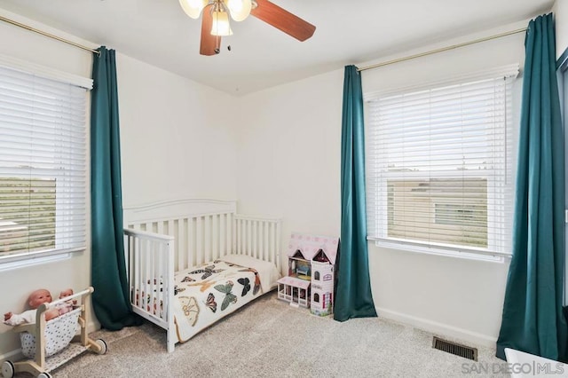 carpeted bedroom with ceiling fan