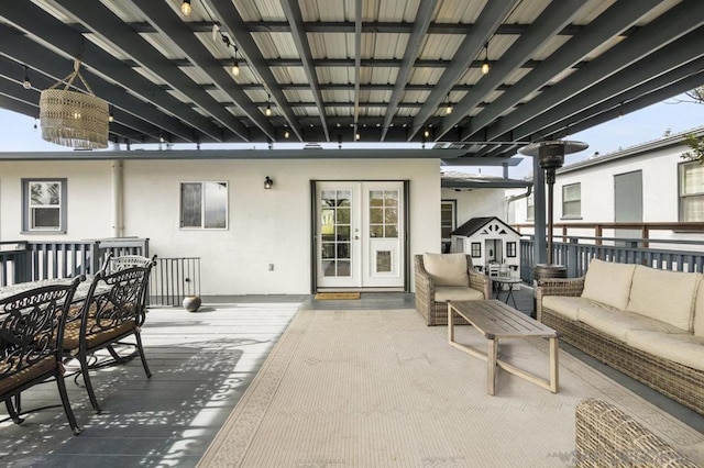 view of patio featuring an outdoor living space, a deck, and french doors