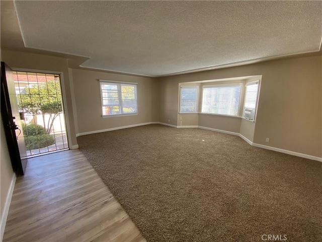 1605 S Atlantic Blvd, Alhambra, CA 91803 - unfurnished room featuring a textured ceiling, baseboards, and wood finished floors