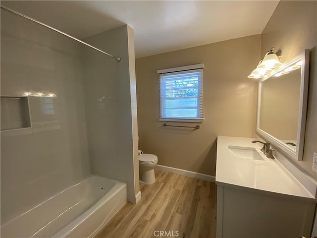 1605 S Atlantic Blvd, Alhambra, CA 91803 - bathroom featuring wood finished floors, toilet, vanity, baseboards, and  shower combination