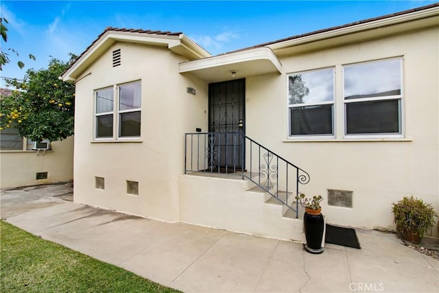 1605 S Atlantic Blvd, Alhambra, CA 91803 - entrance to property featuring stucco siding and a patio