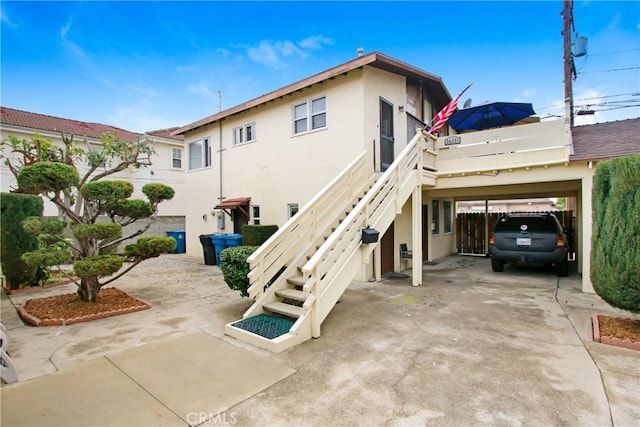 1605 S Atlantic Blvd, Alhambra, CA 91803 - rear view of house with stucco siding and stairs
