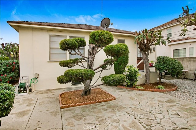 1605 S Atlantic Blvd, Alhambra, CA 91803 - view of front facade with stucco siding and a patio