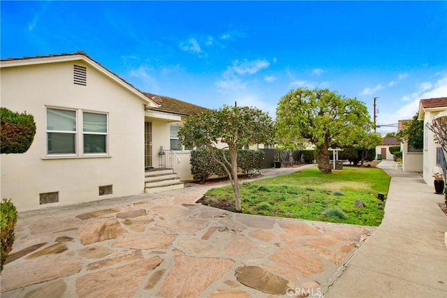 1605 S Atlantic Blvd, Alhambra, CA 91803 - view of grassy yard featuring a patio area