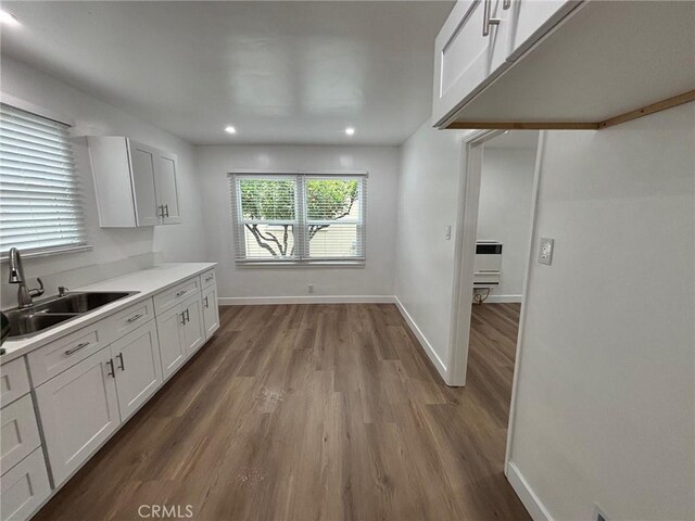 1605 S Atlantic Blvd, Alhambra, CA 91803 - kitchen with a sink, white cabinets, wood finished floors, baseboards, and recessed lighting