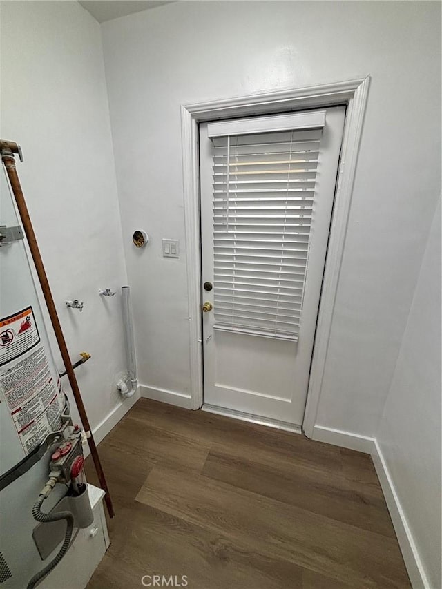 1605 S Atlantic Blvd, Alhambra, CA 91803 - entryway with dark wood-style floors, strapped water heater, and baseboards