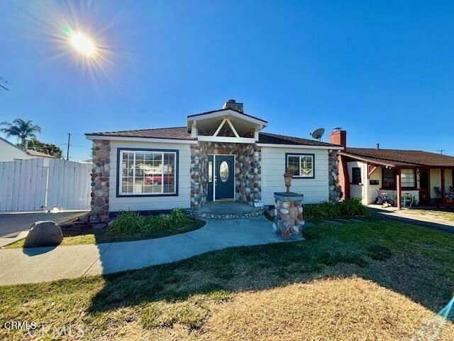 ranch-style house with a front lawn