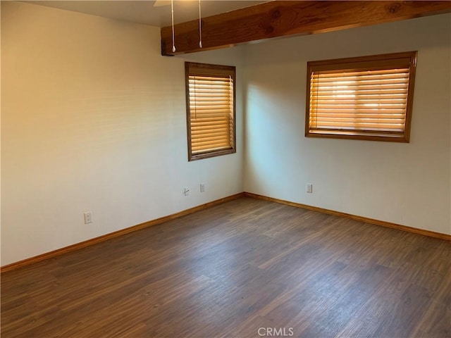 empty room with dark wood-type flooring