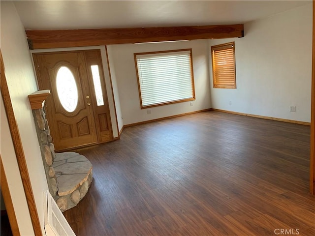 entrance foyer with beamed ceiling and dark hardwood / wood-style floors