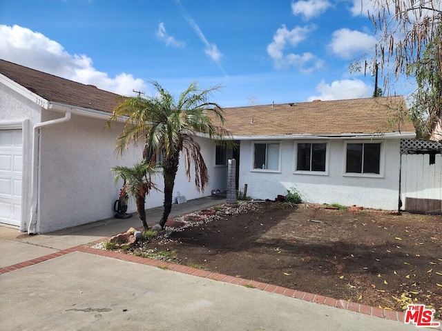 single story home with a garage