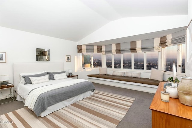 carpeted bedroom with vaulted ceiling