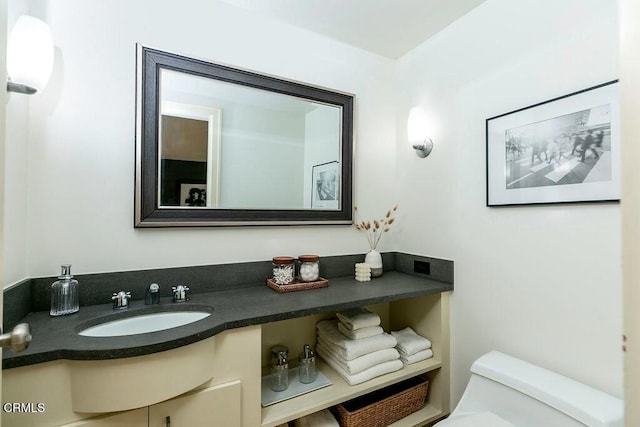 bathroom featuring vanity and toilet