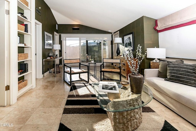 living room featuring vaulted ceiling and built in features