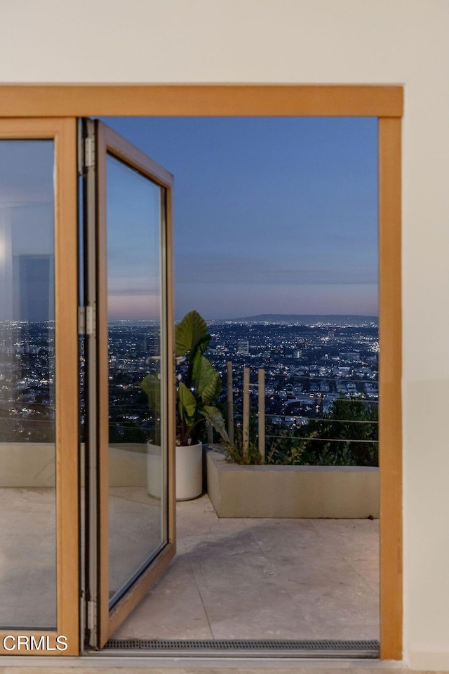 8326 Grand View Dr, Los Angeles, CA 90046 - balcony at dusk with a view of city