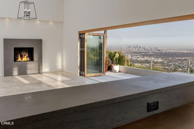 8326 Grand View Dr, Los Angeles, CA 90046 - interior space with a lit fireplace and a city view