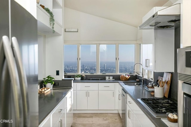 8326 Grand View Dr, Los Angeles, CA 90046 - kitchen featuring stainless steel appliances, range hood, white cabinetry, dark countertops, and vaulted ceiling