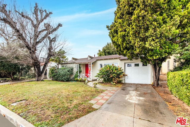 view of front of house with a garage and a front yard