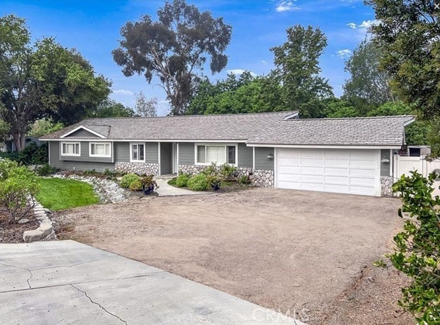 ranch-style house featuring a garage