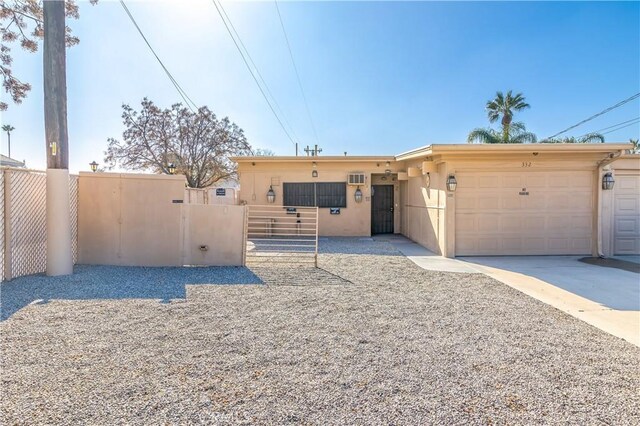 332 E 7th St, San Jacinto, CA 92583 - view of front of home featuring a garage
