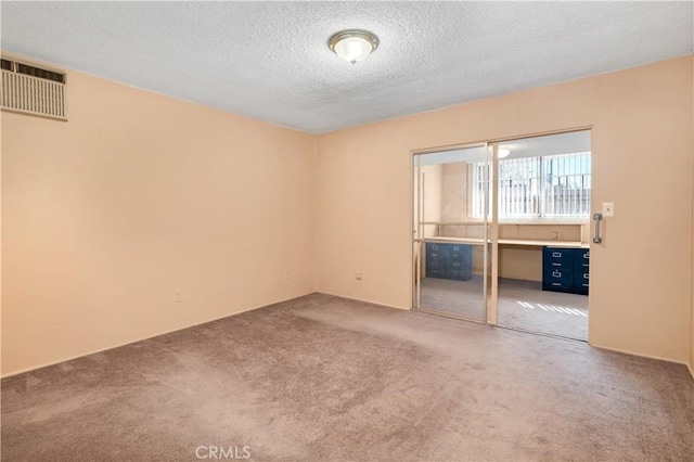332 E 7th St, San Jacinto, CA 92583 - unfurnished room featuring carpet and a textured ceiling