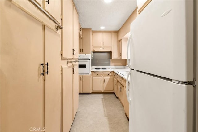 332 E 7th St, San Jacinto, CA 92583 - kitchen featuring white appliances, cream cabinets, and sink