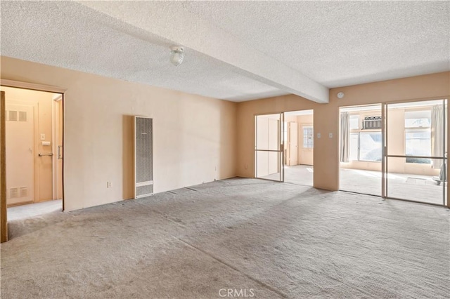 332 E 7th St, San Jacinto, CA 92583 - carpeted spare room with beam ceiling and a textured ceiling