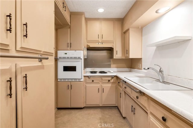 332 E 7th St, San Jacinto, CA 92583 - kitchen with sink, white appliances, cream cabinets, and a textured ceiling