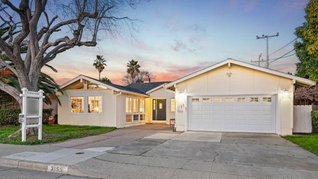 ranch-style home featuring a garage