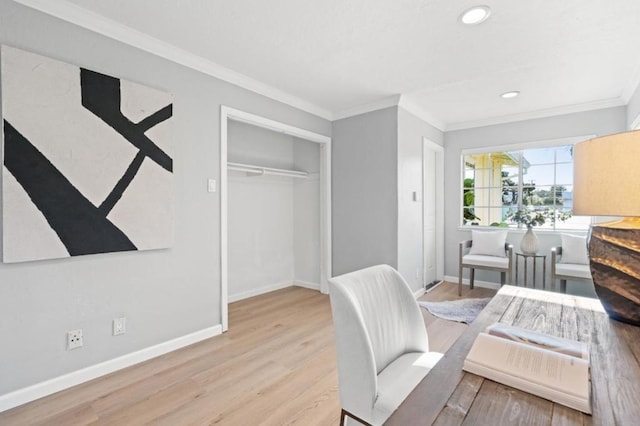 office area featuring crown molding and light hardwood / wood-style flooring