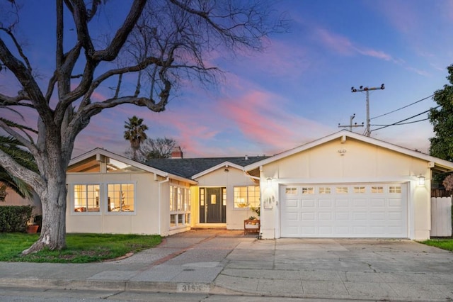 ranch-style house featuring a garage