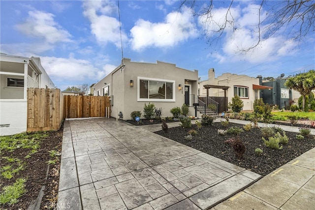 view of front of property featuring a pergola