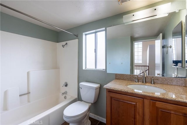 full bathroom featuring shower / bathtub combination, vanity, and toilet