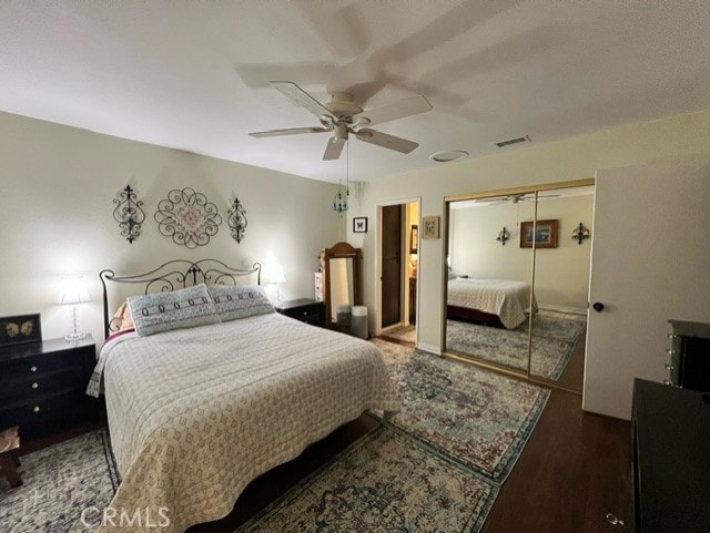 bedroom with hardwood / wood-style flooring and ceiling fan